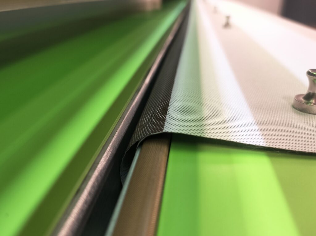 Heat welding machine used to create hem pockets for roller shade fabric replacement in NYC