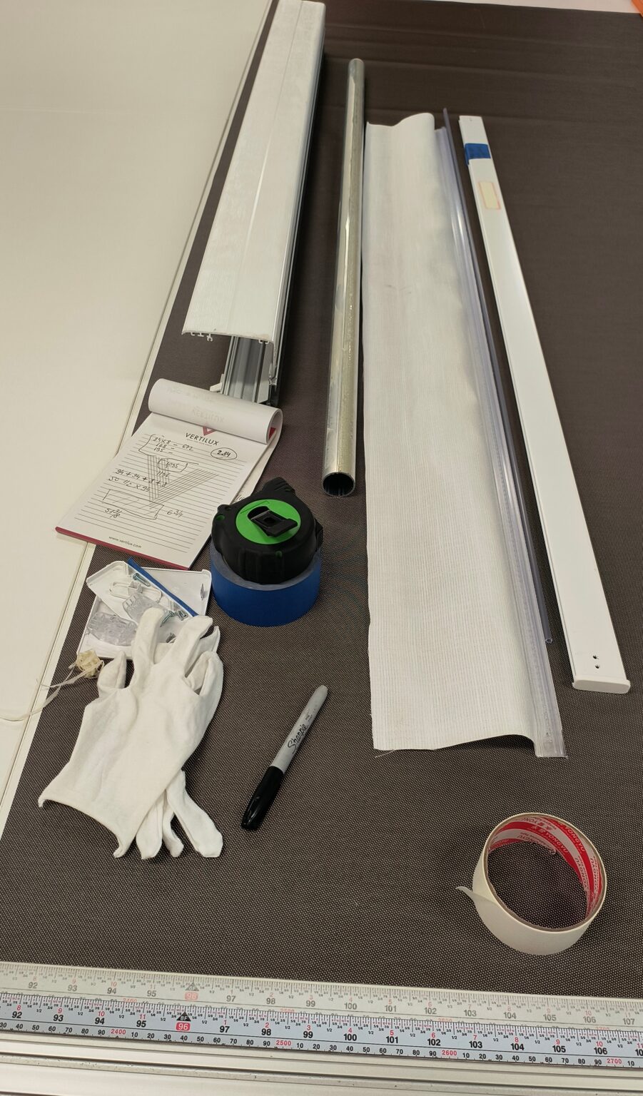 Roller shade fabric measurement tools and workshop setup in NYC