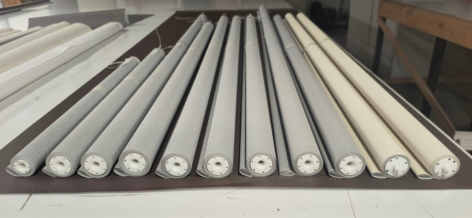 Roller shades with new fabric installed during fabric replacement service in NYC