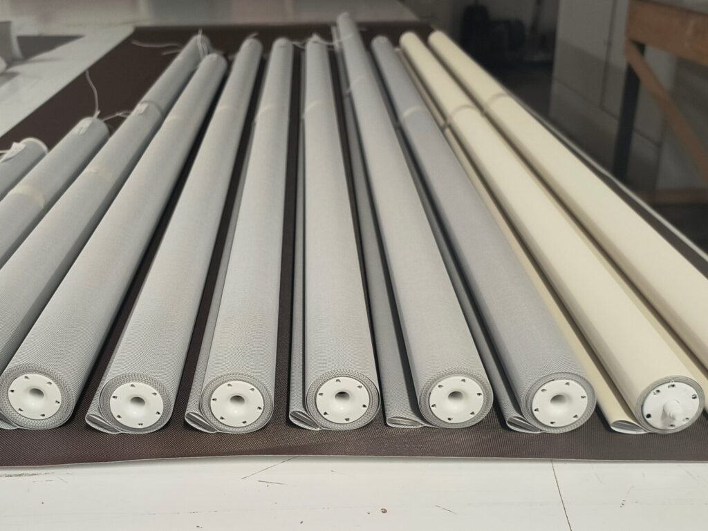 Roller shades with new fabric installed during fabric replacement service in NYC