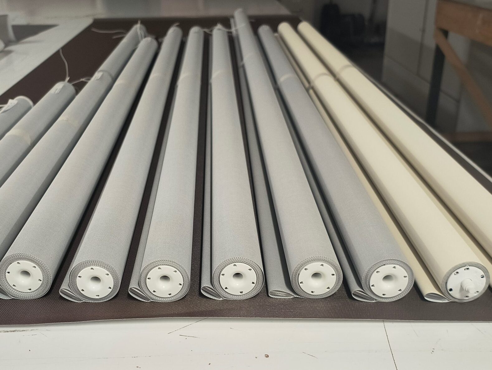 Roller shades with new fabric installed during fabric replacement service in NYC