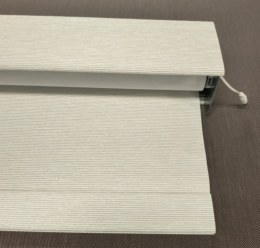 Motorized roller shade with replacement fabric installed