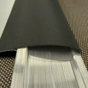 Aluminum hem bar inserted into welded roller shade fabric pocket