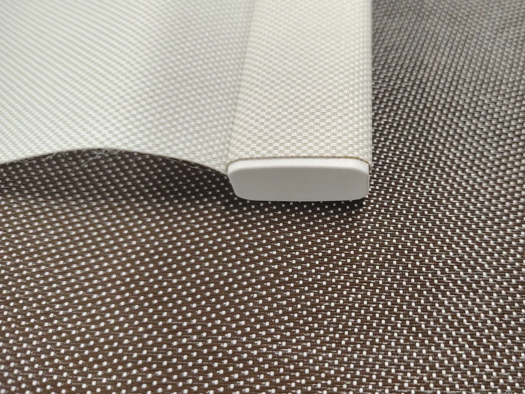 Roller shade fabric with wrapped bottom hem bar