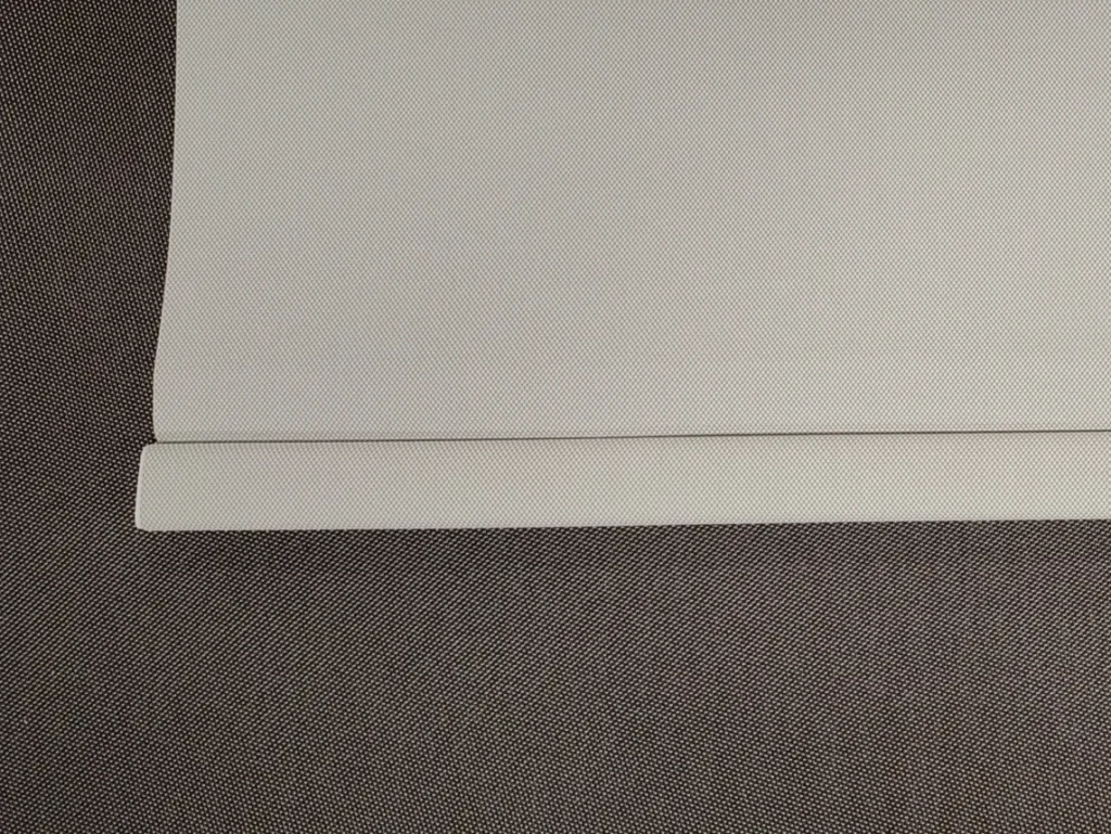 White roller shade fabric with wrapped bottom hem bar